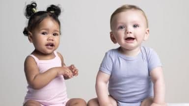 A baby girl and a baby boy, symbolizing the heartbreaking loss of a pregnant cow's twins due to Bovine TB.