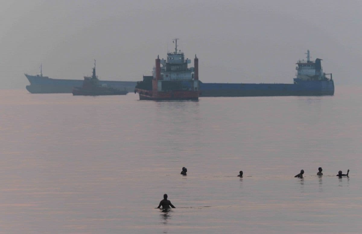 A cargo ship navigating through the Strait of Hormuz.