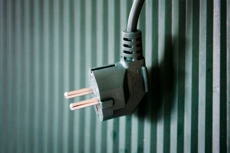 A close-up of an electrical plug, symbolizing energy infrastructure and future power connections.