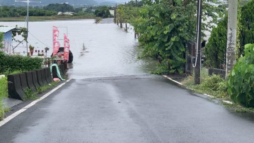 A flooded road in a rural area of Taiwan, highlighting the need for community preparedness and resilient infrastructure against unpredictable heavy rainfall.