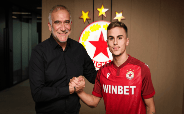 A football club official shaking hands with a young player, symbolizing investment in homegrown talent and a sustainable future.