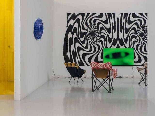 A modern art gallery featuring abstract patterns and digital displays, symbolizing Singapore's embrace of cutting-edge technology and innovation for future prosperity.