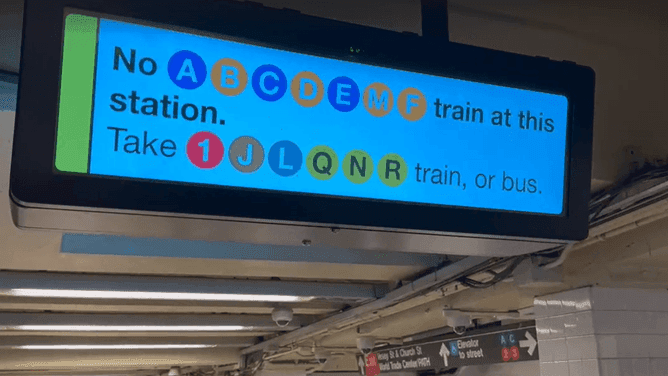 A New York City subway sign indicating suspended B and C lines due to a power outage during extreme heat.