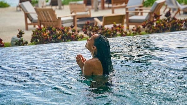 A person pouring a craft beer from a tap, symbolizing growth and reinvestment in local breweries
