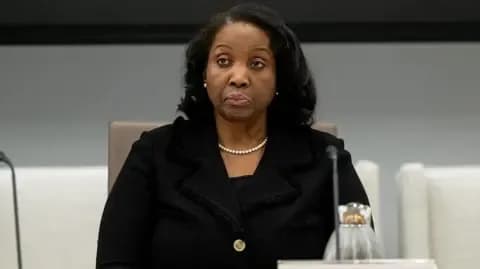 A portrait of a US economist or policymaker, representing the experts and officials involved in rethinking AGOA's future.