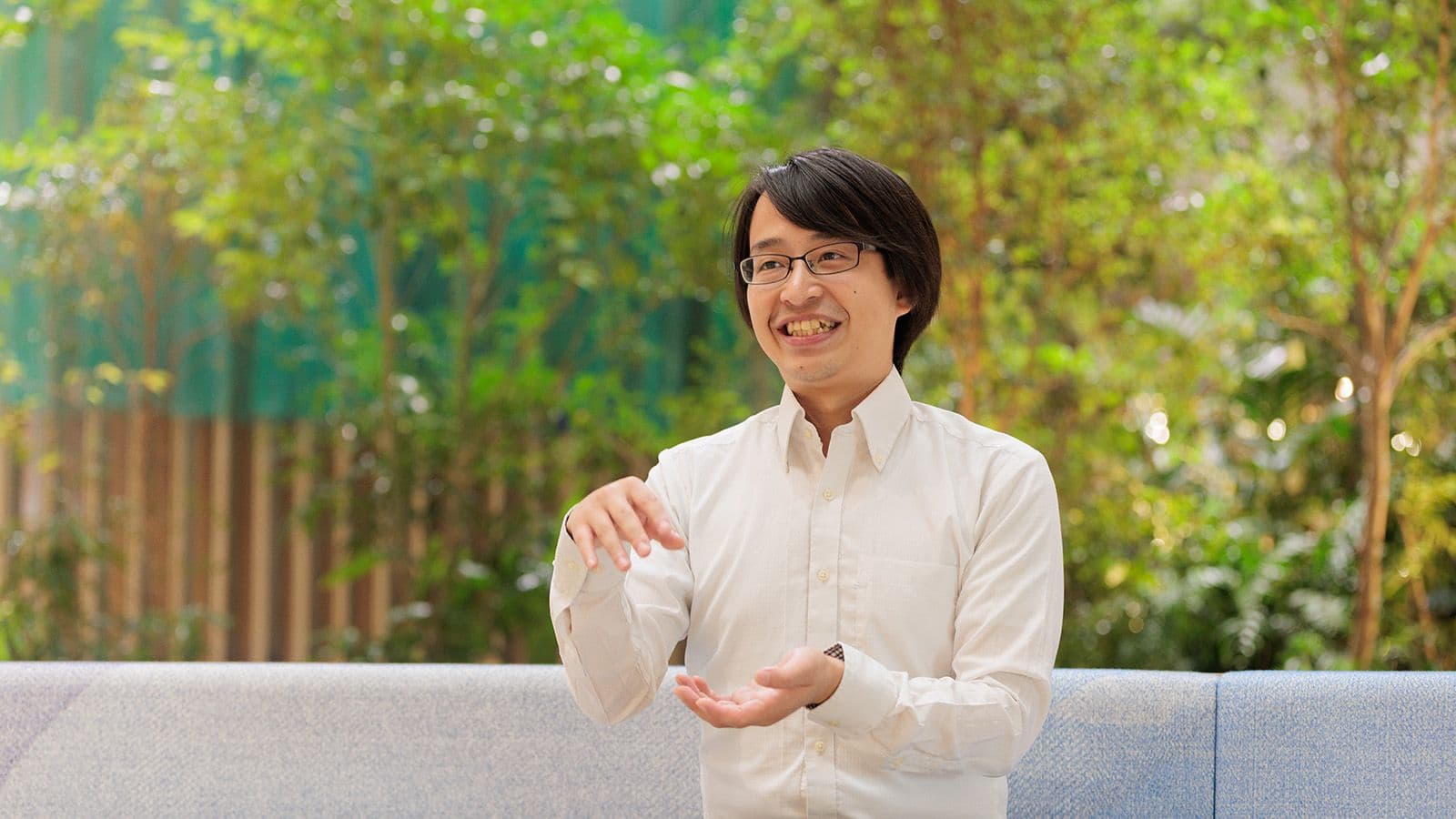 A professional discussing YKK's expanded vision and integration of new housing solutions