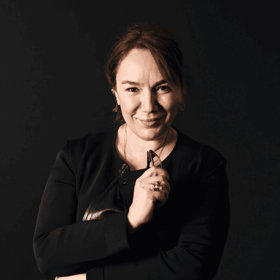 A professional woman symbolizing expertise in leveraging BIM for financial command in real estate.