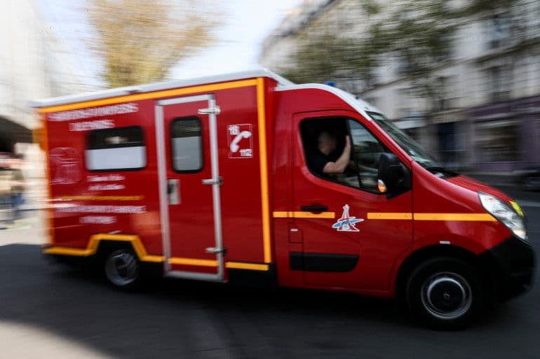 A red French fire department vehicle speeding with motion blur, symbolizing the urgent response to escalating wildfires in Europe.
