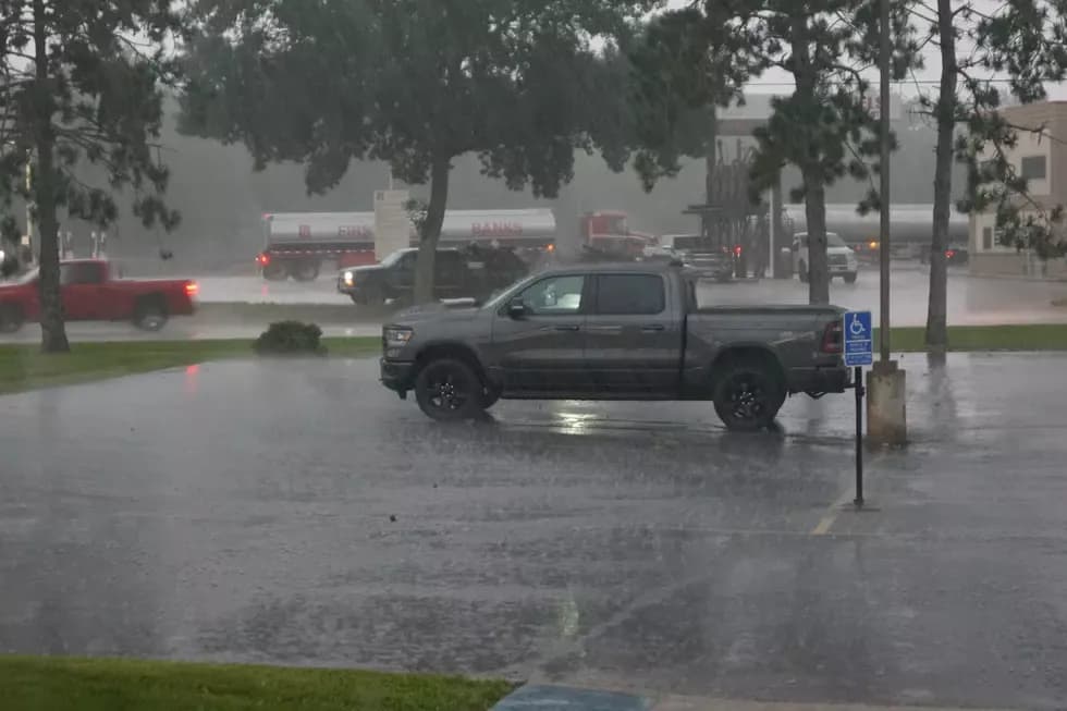 A street in Central Minnesota during heavy rainfall on July 23rd, 2025, showing the immediate impact of the deluge.