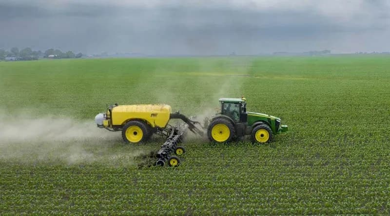 A tractor spraying a field, representing agricultural chemical application practices relevant to new EU residue limit negotiations.