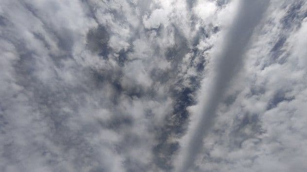 A view of a cloudy sky with various cloud formations, illustrating the dynamic and ever-changing nature of the atmosphere.
