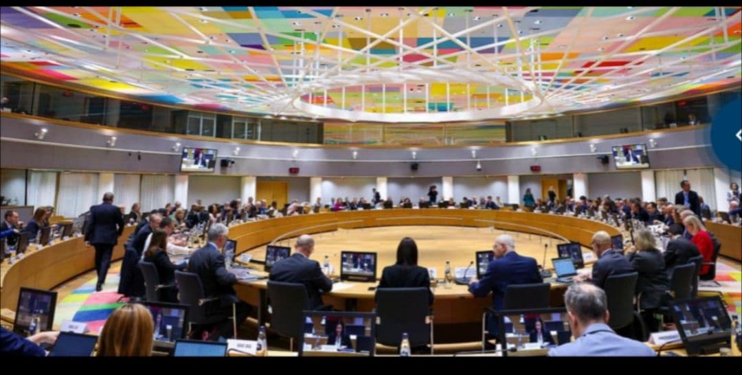 A wide-angle view of a circular conference room where EU Council delegates meet to discuss legislative matters.