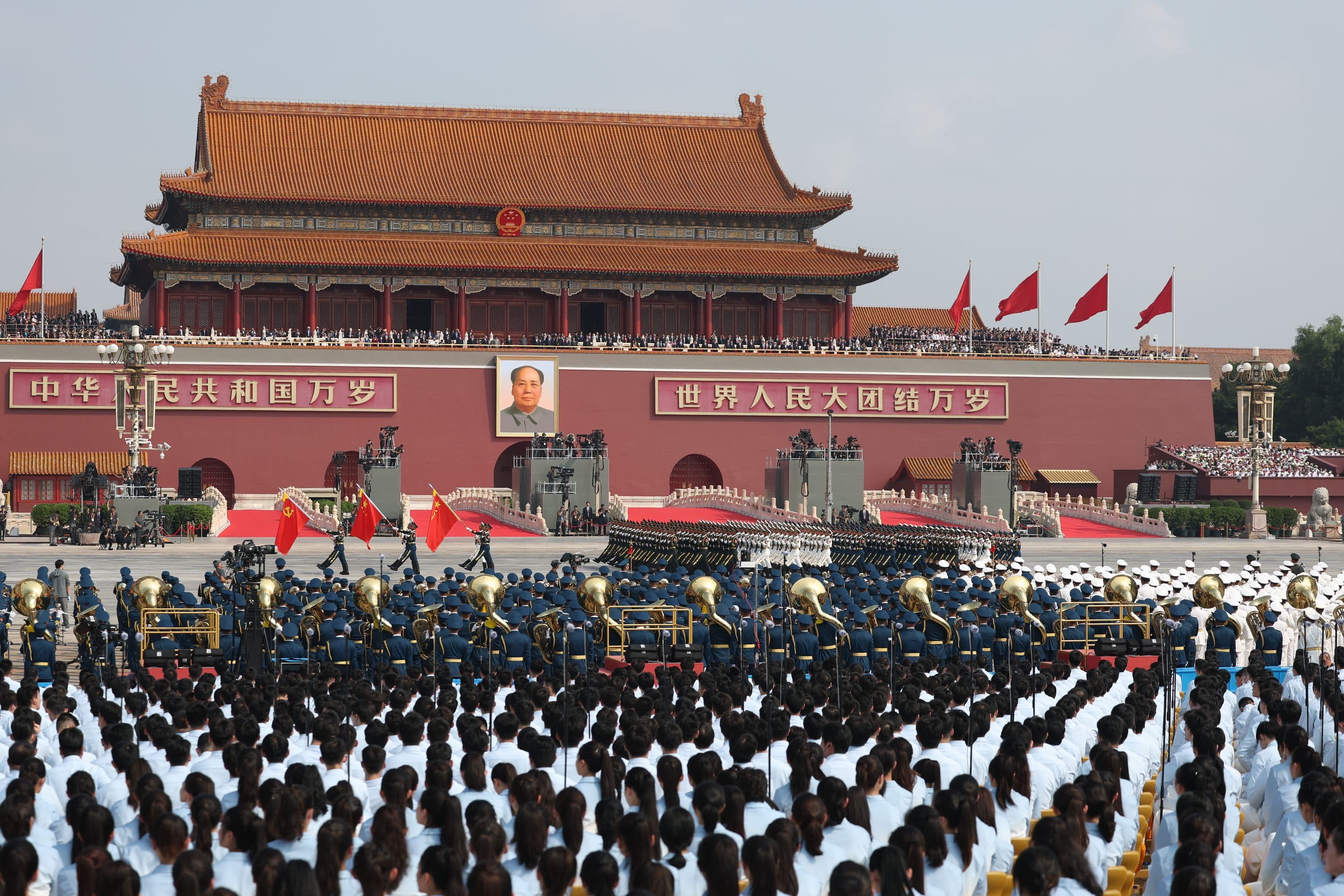 A wide view of a military parade at Tiananmen Gate in Beijing, symbolizing China's global presence.