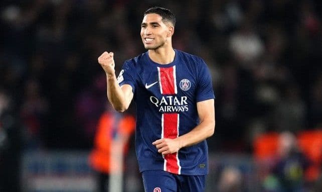Achraf Hakimi celebrating in a PSG jersey, representing the controversies around player statements and public polemics.