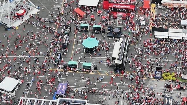 Aerial view of a large crowd of baseball fans gathered outside Bristol Motor Speedway before the MLB Speedway Classic.