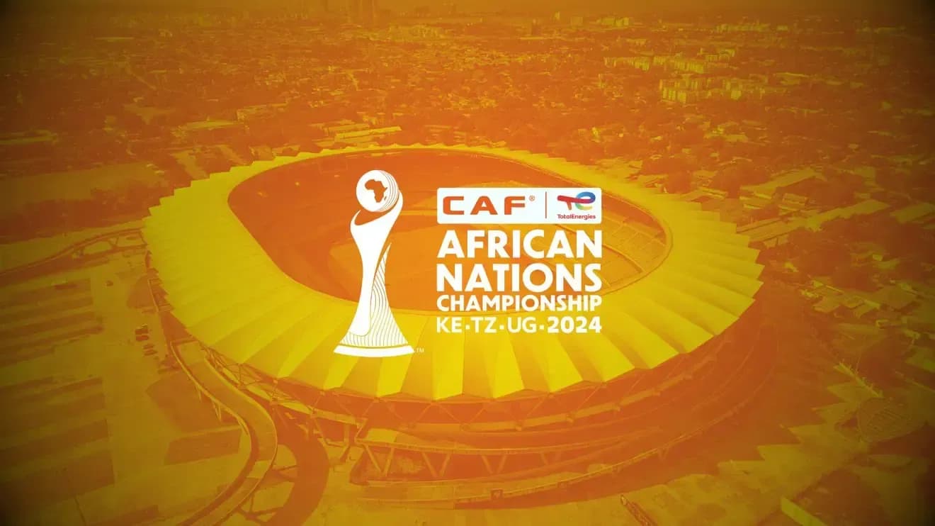 Aerial view of a stadium with the CAF African Nations Championship 2024 logo, representing the tournament in Kenya, Tanzania, and Uganda.