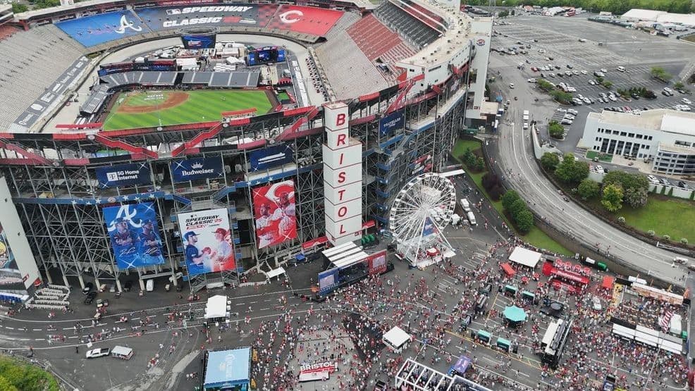 Aerial view of Bristol Motor Speedway transformed into a baseball field, surrounded by a large crowd gathered for the MLB Speedway Classic.