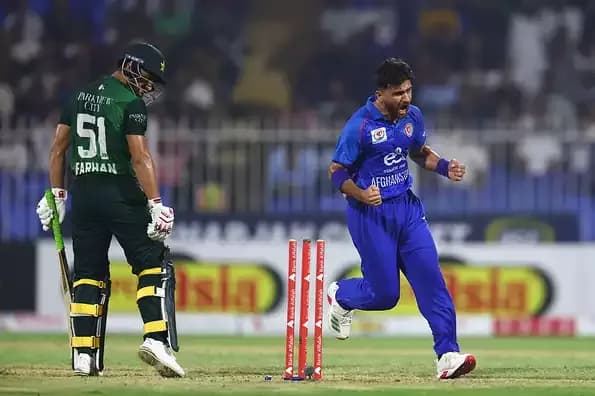 Afghan bowler Fazalhaq Farooqi celebrates a wicket against Pakistan, highlighting Afghanistan's growing success in T20 cricket.