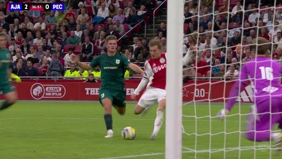 Ajax player in red and white kit scoring a goal against PEC Zwolle, with the scoreboard showing 2-0 at 36:51.