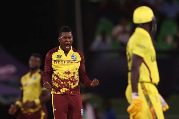 Akeal Hosein, West Indies left-arm orthodox spinner, celebrating a wicket during a cricket match.