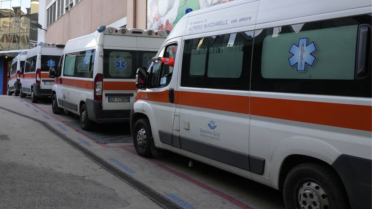 Ambulances parked outside a hospital in Italy during a botulism outbreak, symbolizing the public health crisis and human toll.
