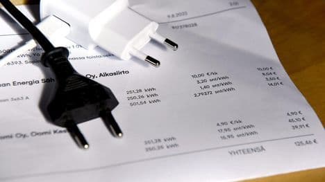 An electricity bill with Oomi branding and power plugs, representing Finland's consolidating energy market.