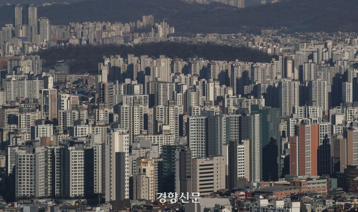 An expansive view of a dense South Korean cityscape, representing the diverse urban environments and microclimates within the country's dynamic summer.
