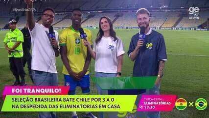 Apresentadores da ge tv no gramado após o jogo Brasil x Chile, representando a cobertura e análise pós-jogo do canal
