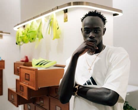 Australian sprinter Gout Gout at an Adidas panel talk in Tokyo, symbolizing his global rise.