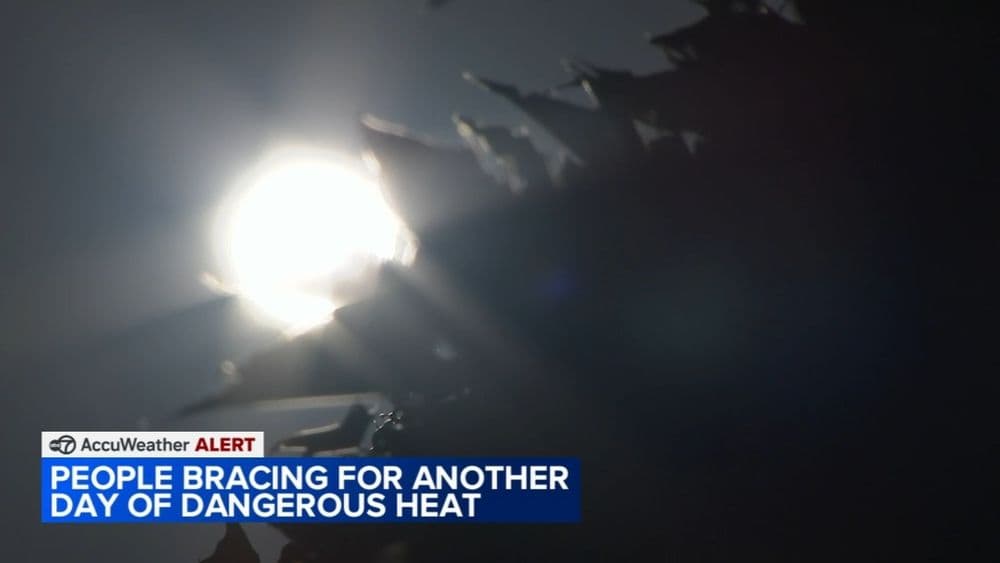 Bright sun with a weather alert overlay, indicating dangerous heat in Chicago.