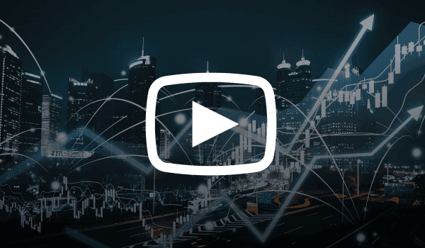 City skyline at night with overlayed financial charts and upward trending arrows, representing global economic trends impacting cryptocurrency markets.