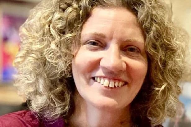 Close-up portrait of Janet Percival, co-founder of Jaspels Cider, smiling.