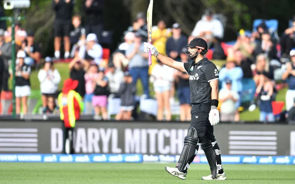Daryl Mitchell raising his bat after scoring a century for New Zealand against West Indies at Hagley Oval.