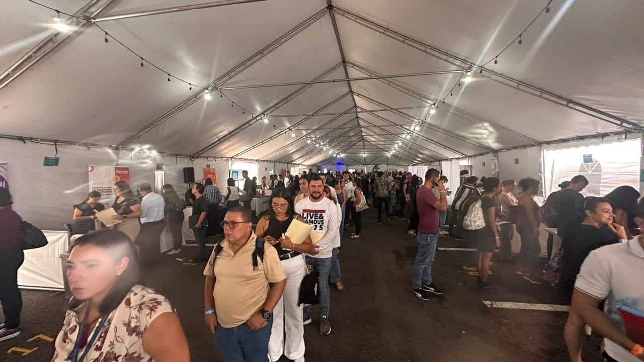 Displaced residents seeking shelter in a large tent after severe flooding in Guatuso.
