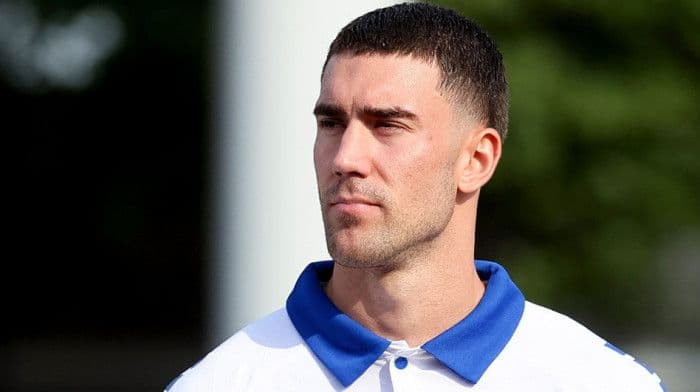 Dušan Vlahović looking pensive, highlighting the contrast with Vasilije Adžić's meteoric rise to instant icon status.