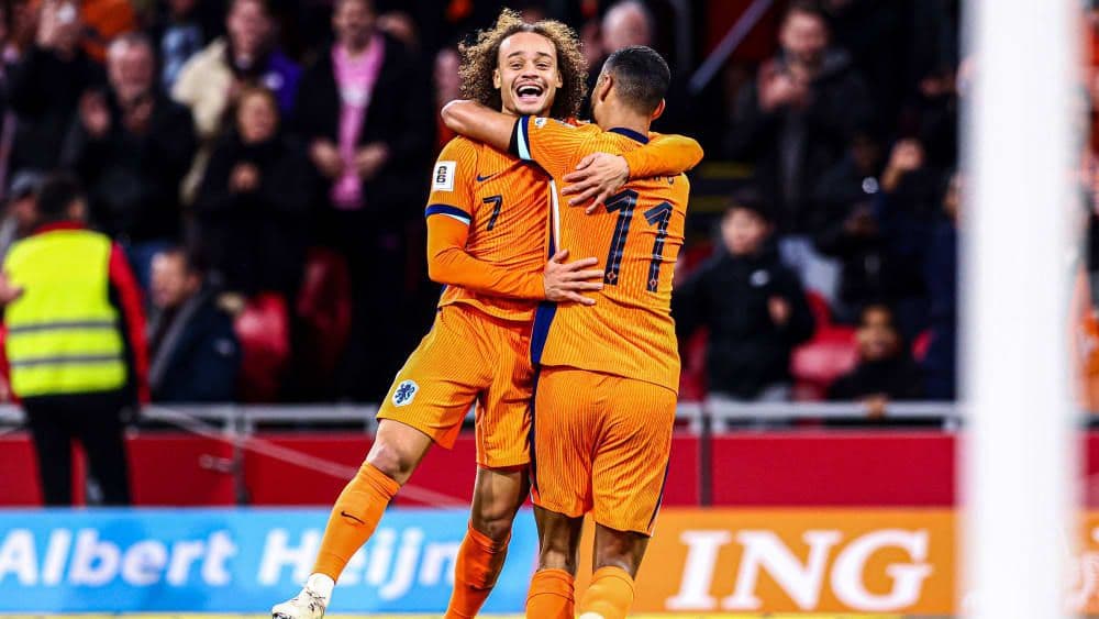Dutch players Xavi Simons and Cody Gakpo celebrating a goal during their World Cup qualifier.