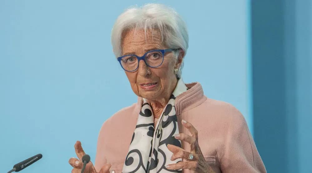 ECB President Christine Lagarde speaking at a press conference, representing the central bank's efforts to navigate economic stability.