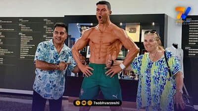 Fans with a Cristiano Ronaldo statue, illustrating the high-profile talent attracted to the Saudi Pro League.