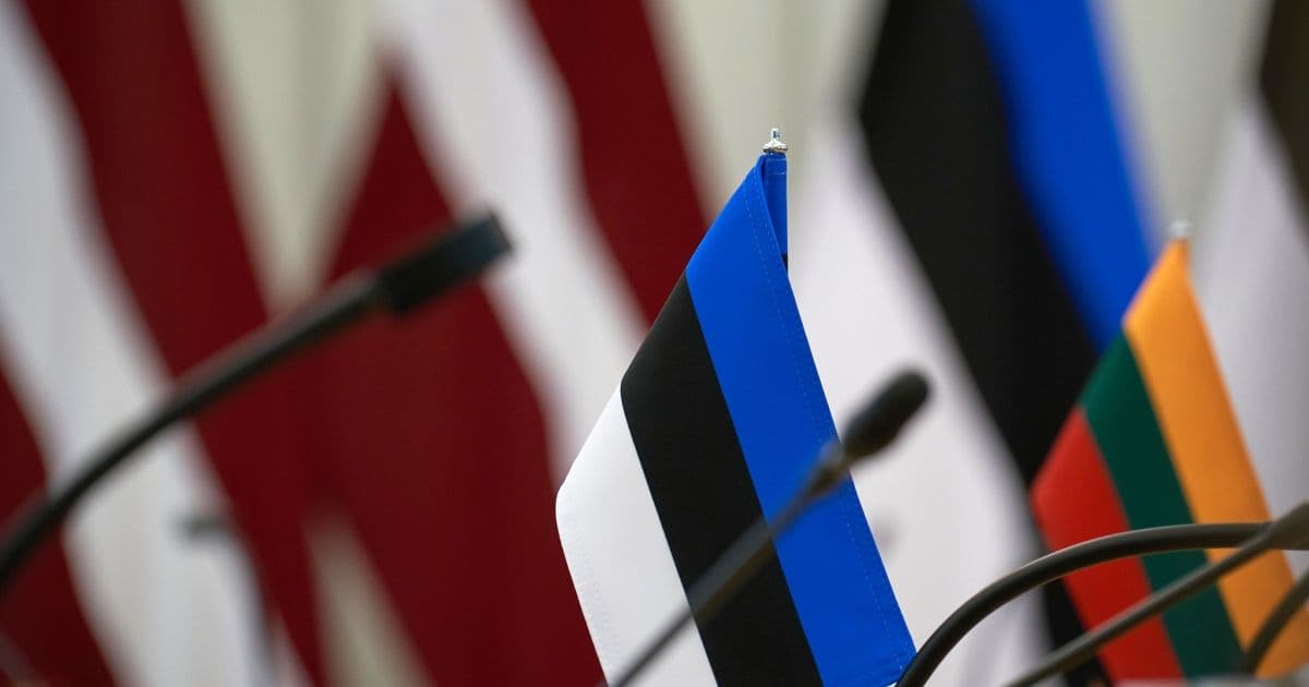 Flags of Estonia, Latvia, and Lithuania displayed together, representing the joint diplomatic push by the Baltic states.