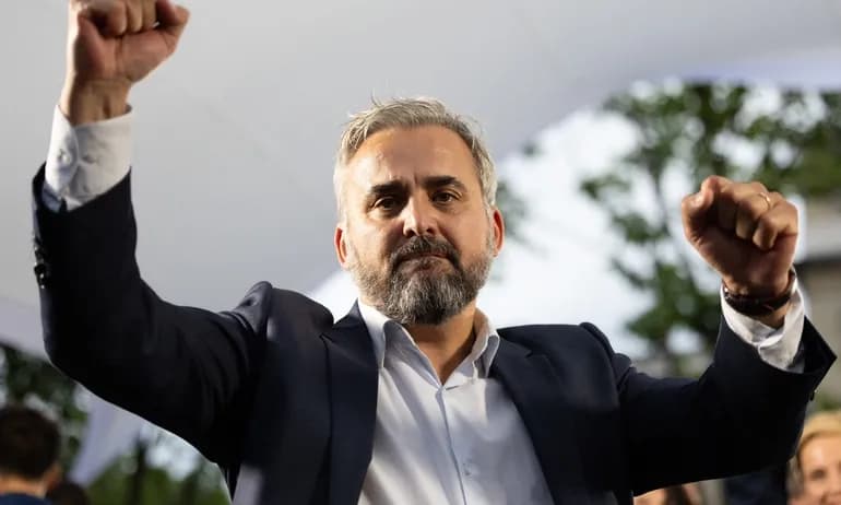French politician Alexis Corbière with raised fists, representing political determination and executive power.
