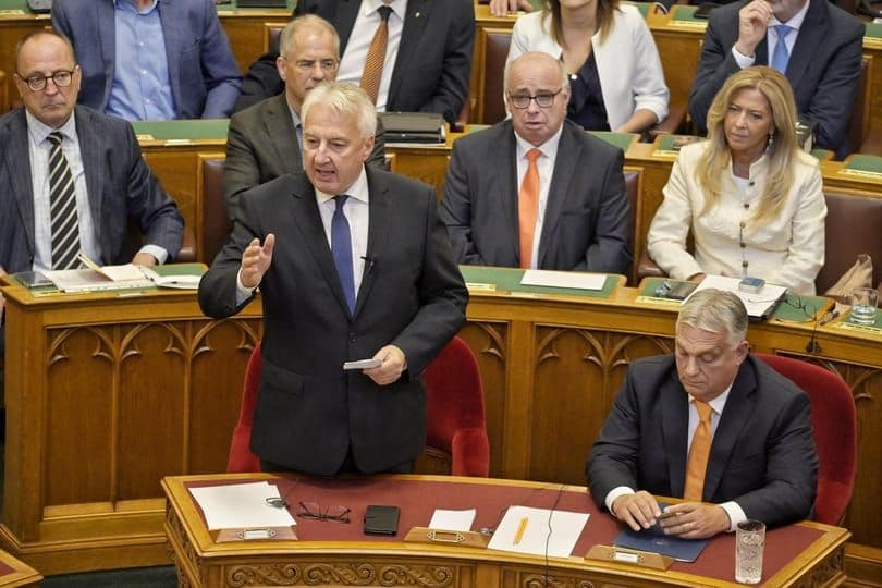 Hungarian politicians, including Viktor Orbán, in parliament, reflecting the interplay of politics and economy
