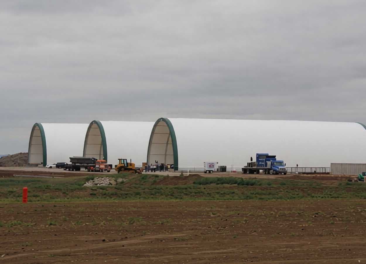 Industrial warehouse facility used for storage of agricultural bulk materials and fertilizer components.