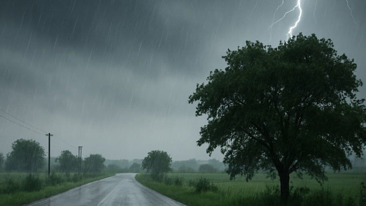 Intense monsoon rain and lightning strike over a rural road in Uttar Pradesh, symbolizing the severe weather crisis.