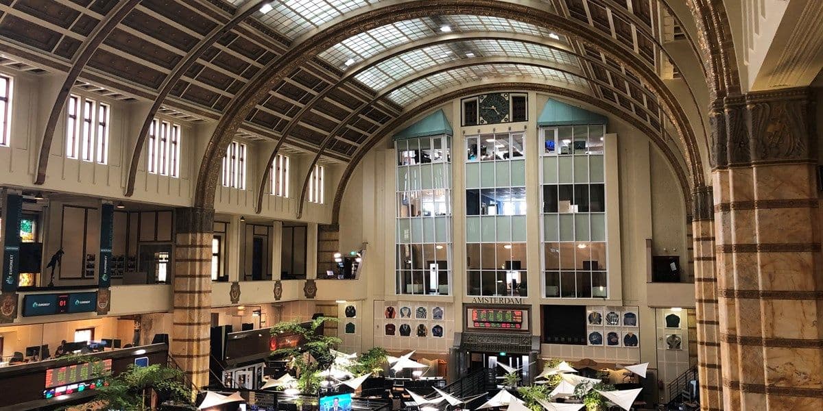 Interior of the Euronext Amsterdam stock exchange, representing the AEX market dynamics.