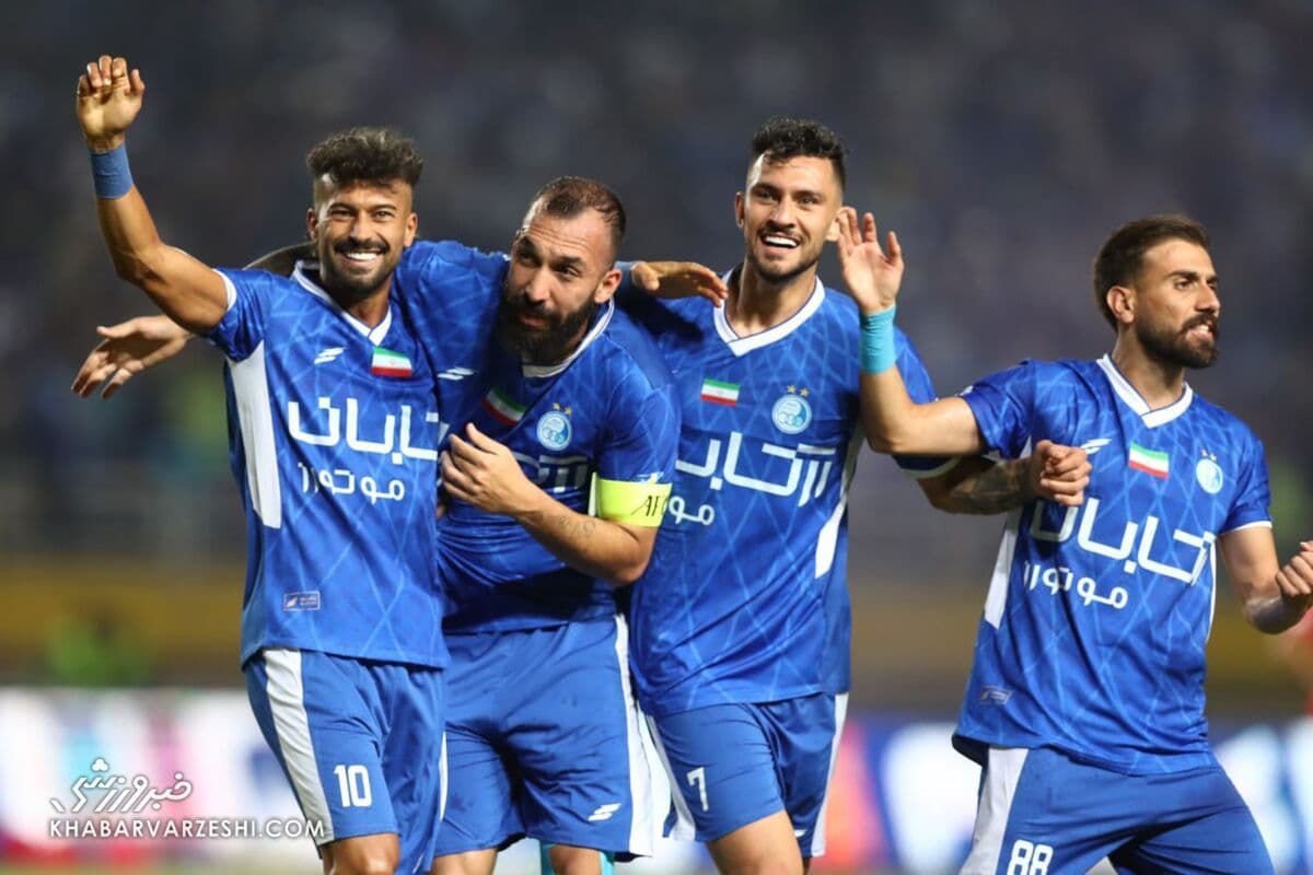 Iranian national football team players celebrating during a high-stakes match.