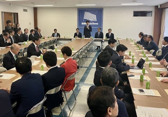Japanese Liberal Democratic Party officials in a meeting discussing agricultural policy shifts and rice production targets.