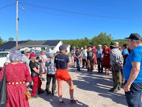 Local residents gathered outdoors, protesting and demanding the dismantling of the cross-dam on the Tana River.