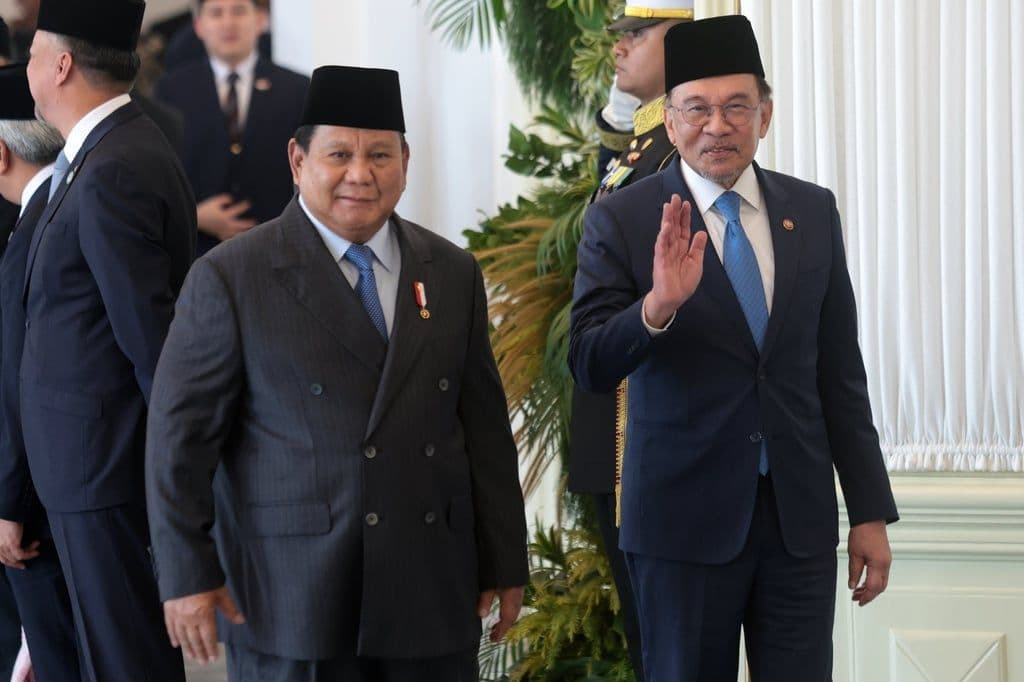 Malaysian Prime Minister Anwar Ibrahim and Indonesian President Prabowo Subianto, symbolizing regional collaboration and economic partnership.