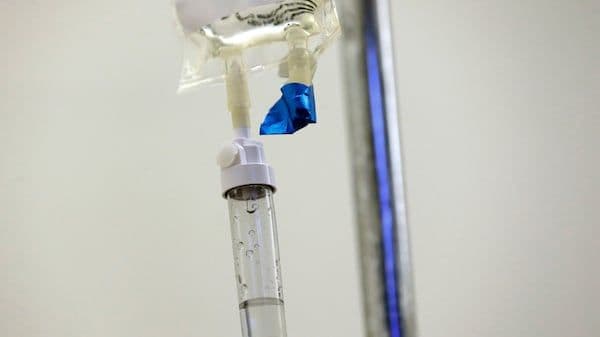 Mark Carney in a suit, looking thoughtful, representing his strategic influence on Canada's bilateral trade policy.