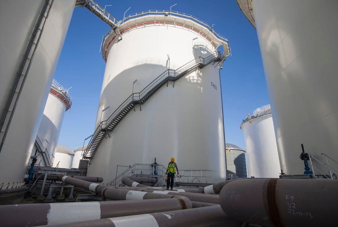 Massive oil storage tanks at a Vitol joint venture facility, representing the company's vast global energy infrastructure.